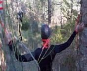 Tied to a tree on a sexy outfit, masked and outdoor deepthroat with no mercy from penis tree