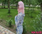 Pink haired beauty walks in the park in a blue sky costume from koen